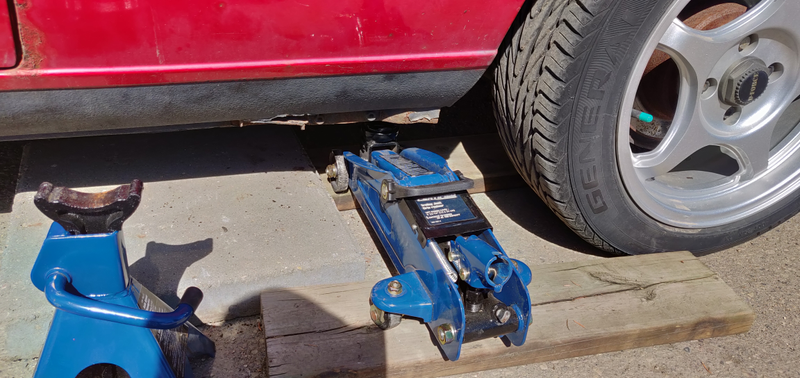 Slab of concrete so the jack-stand doesn’t sink again